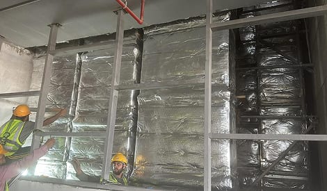 HVAC ductwork and thermal insulation installation on site