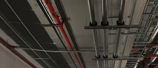 Overhead MEP services — piping and cable-tray routing