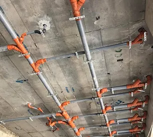 Electrical conduit rough-in across a concrete soffit